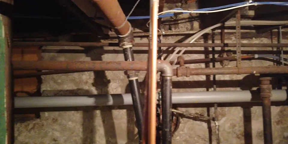 Basement drain piping and vent lines below floor joists for Plumber in Bellflower, CA