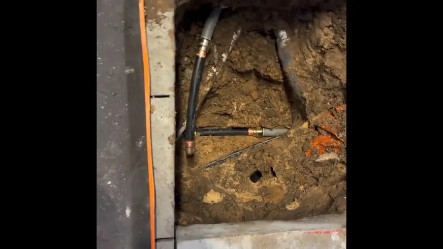 Cracked clay sewer pipe visible in an open trench for Sewer Line Repair in Lakewood, CA