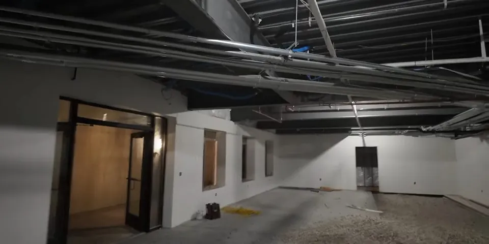 Open commercial suite prepared for drain rough-in for ADU Plumbing Installation in Lakewood, CA