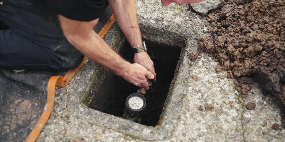 Sewer cleanout opened in a small excavation for Sewer Camera Inspection in Lakewood, CA