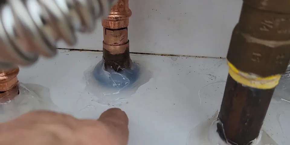 Tankless water heater vent and gas piping at a wall for Tankless Water Heater Services in Lakewood, CA