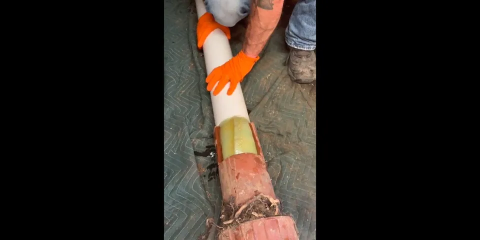 Trenchless liner being fed into a sewer pipe for How CIPP Trenchless Sewer Lining Works and Why It’s the Right Fix for