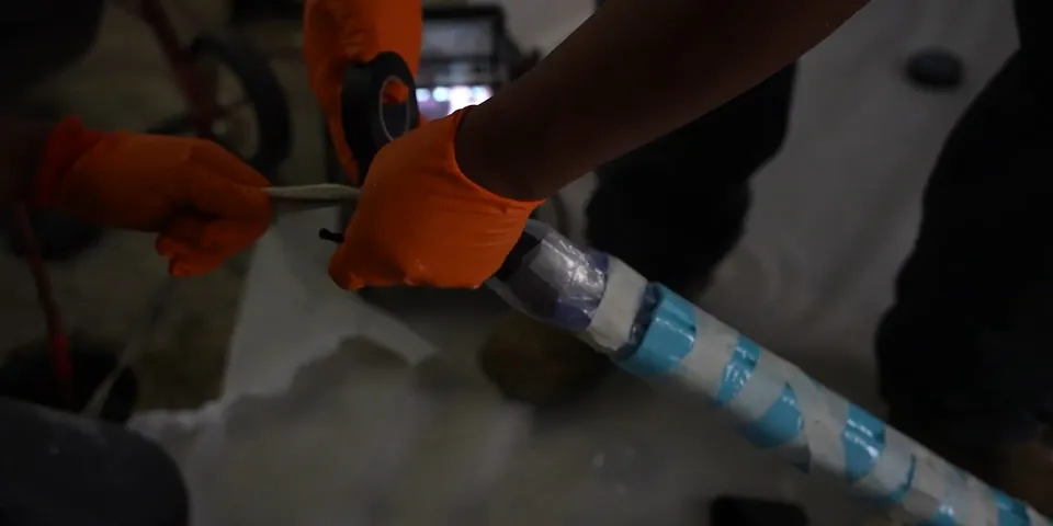 Trenchless repair material being inserted into a pipe for Plumbing Service in the Mayfair District, Lakewood CA
