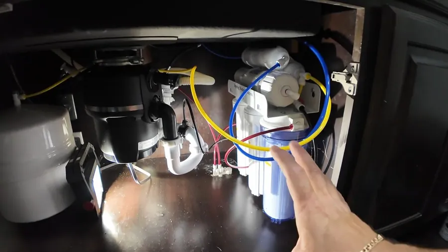 Under-sink garbage disposal connected to drain and filter lines for Garbage Disposal Repair & Installation in Lakewood, CA