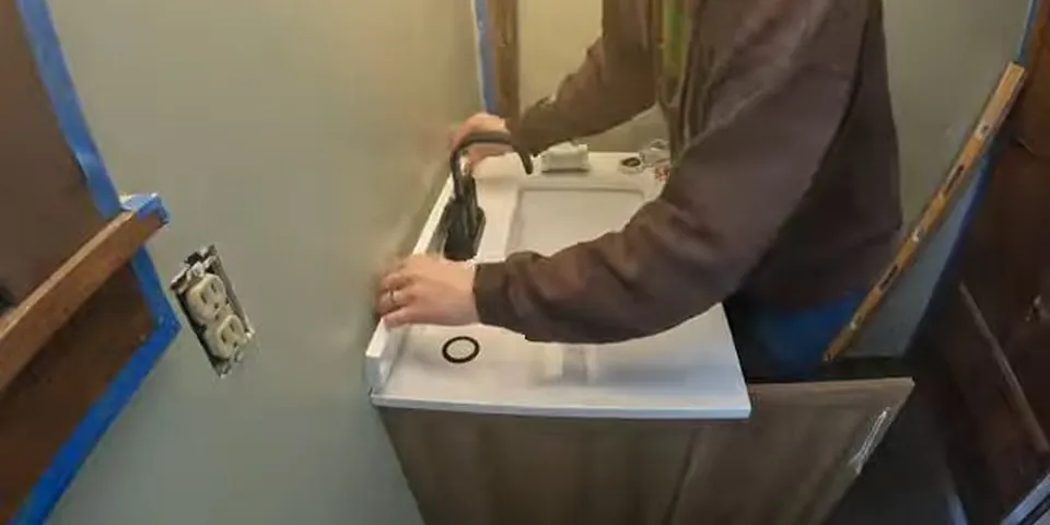 Wall-mounted bathroom faucet being connected during remodel work for Fixture Repair & Installation in Lakewood, CA
