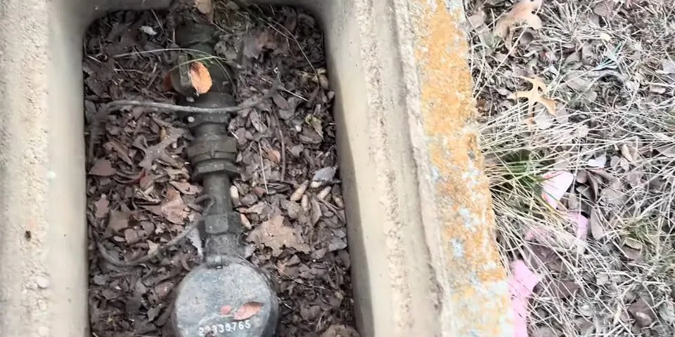 Water meter box with shutoff valve and debris for How to Read Your Lakewood Water Meter to Check for Hidden Leaks